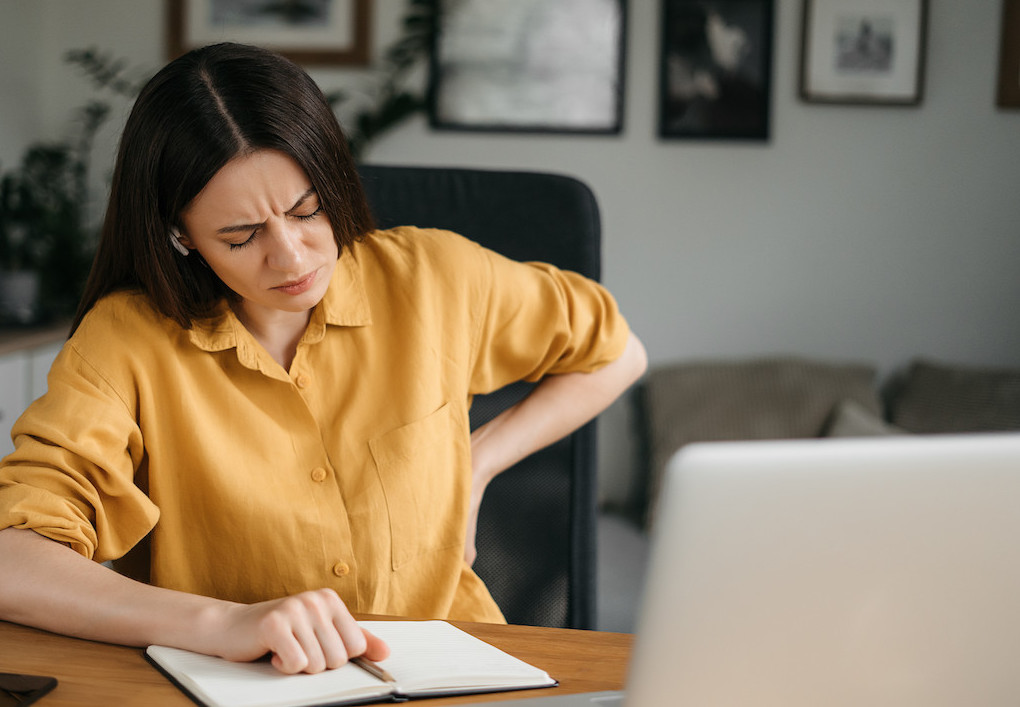 woman sitting for long period, bad posture